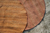 Orange jute round rug texture close-up detail