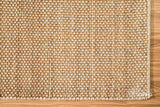 Beige wool rug shown at an alternate angle