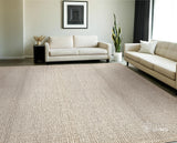 Sumac braided wool rug in a bedroom setting