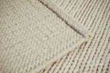 Ivory wool rug corner and edge detail