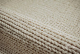 Ivory wool rug texture close-up