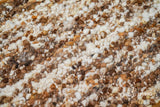 Pile close-up showing ivory brown wool color blend