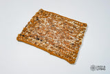 Rust brown textured wool rug, flat lay view