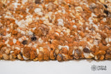 Pile close-up showing rust brown wool color variation
