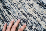 Texture close-up of handwoven ivory blue wool