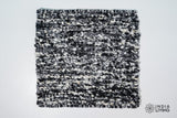 Close-up of organic wool texture in ivory black