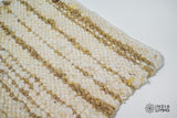 Ivory beige wool rug in a bright bedroom setting