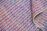 Purple wool rug under a coffee table