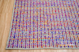Purple wool rug texture close-up showing handwoven weave
