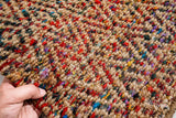 Natural jute diamond rug styled in a living room