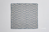 Close-up of geometric wool weave texture in bluish grey