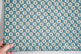 Turquoise blue wool rug under a coffee table