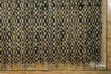 Natural jute rug rolled to show reversible weave
