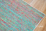 Multi blend teal flatweave rug corner detail