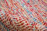 Multi blend red wool rug texture close-up showing handwoven weave