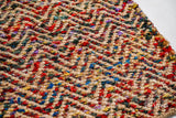 Top-down view of natural multicolour chevron jute rug