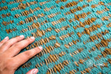 Handwoven jute wool turquoise rug in a modern living space