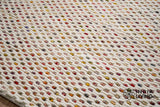 Ivory wool rug colour fleck close-up