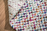 Rug corner detail showing rainbow pattern