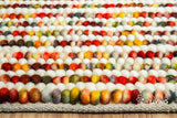 Multi striped wool rug in a Scandinavian-style living room