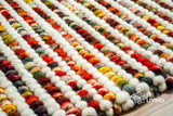 Striped chunky loop rug styled in a living room