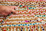 Rainbow rag rug pile close-up texture shot