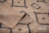 Natural jute area rug placed in a bedroom