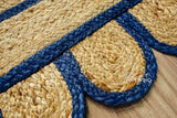 Hand braided navy jute rug in a modern boho living room
