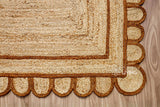Hand braided brown rug shown in an entryway setting