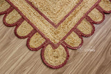 Overhead view of burgundy jute runner on wood flooring