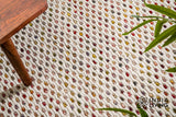 Ivory wool rug styled in a living room