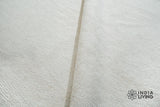 Ivory wool rug texture close-up