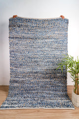 Denim rag rug styled in a boho entryway