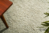 Close-up of textured wool pile in beige