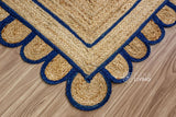 Navy blue jute rug corner detail showing braided texture