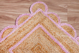 Light pink jute runner in an entryway styled with décor
