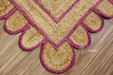 Overhead view of pink jute runner on wood flooring