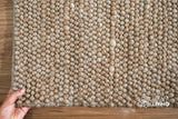 Natural beige chunky wool rug styled in a living room