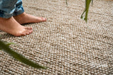 Natural beige chunky wool rug laid flat, full bubble texture view