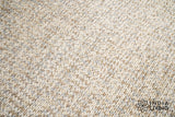 Close-up of cable knit stitching on taupe grey wool rug