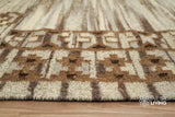 Beige kilim rug styled beside furniture