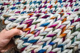 Rainbow cable knit chunky rug flat lay full view