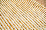 Handwoven rug styled with neutral home decor