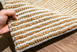 Natural ivory wool jute rug texture close-up in natural light