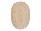 Full view of white oval jute rug on floor