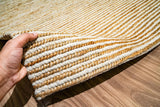 Natural ivory rug detail showing braided weave pattern