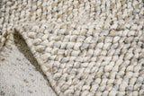 Cashew Loop wool rug — close-up detail of the wool loop pile and finished edge