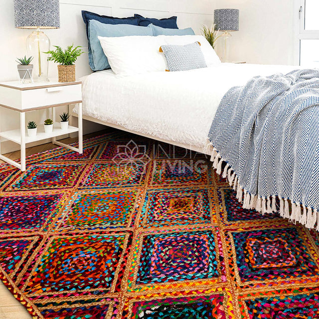 A handwoven natural jute rug in a coastal-style living room with light wood furniture