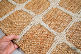 Ivory check jute rug in a hallway setting