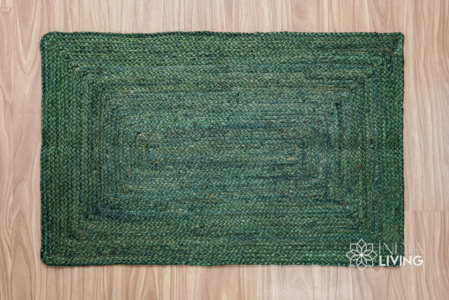 Braided jute rug in dyed green, flat lay view